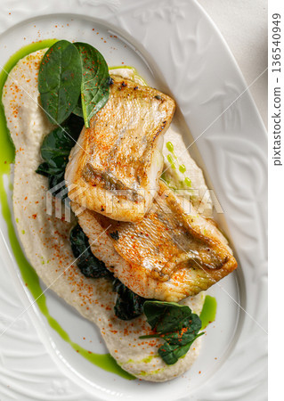 Pan seared white fish with creamy sauce Pan seared white fish with creamy sauce 136540949