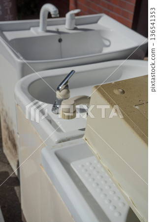 Discarded bathroom vanity 136541353