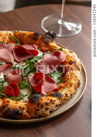 Pizza with roast beef arugula and cheese 136541540