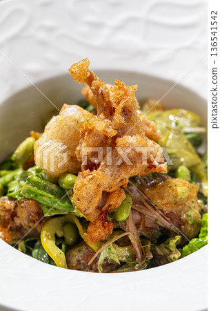 Warm salad with crispy onions and greens Warm salad with crispy onions and greens 136541542