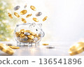 Transparent piggy bank with coins falling | High-resolution business background for asset formation, investment, and savings image (with copy space) 136541896
