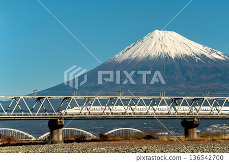 Tokaido Shinkansen N700s crossing the Fujikawa Bridge with Mt. Fuji in the background Tokaido Shinkansen N700s crossing the Fujikawa Bridge with Mt. Fuji in the background 136542700