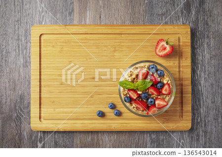 Healthy breakfast bowl with berries and granola Healthy breakfast bowl with berries and granola 136543014