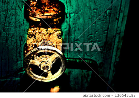 Grunge art water valve, old rusty faucet in green basement Grunge art water valve, old rusty faucet in green basement 136543182