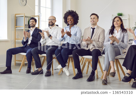 Business office diversity people group, team union applauding sitting in a line, multiracial workers Business office diversity people group, team union applauding sitting in a line, multiracial workers 136543310