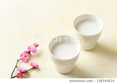 Amazake made with koji poured into a small cup 136543614