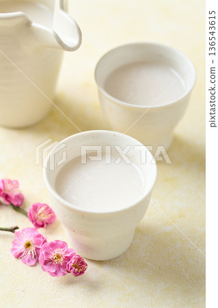 Amazake made with koji poured into a small cup Amazake made with koji poured into a small cup 136543615