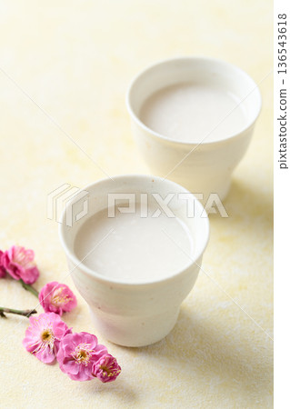 Amazake made with koji poured into a small cup 136543618