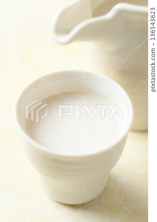 Amazake made with koji poured into a small cup 136543623