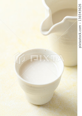 Amazake made with koji poured into a small cup Amazake made with koji poured into a small cup 136543626
