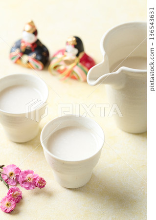 Amazake made with koji poured into a small cup Amazake made with koji poured into a small cup 136543631
