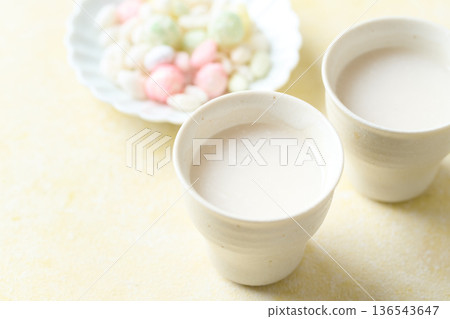 Amazake made with koji poured into a small cup 136543647