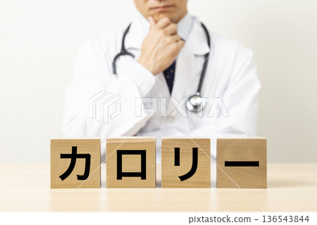 A doctor worries about a block labeled "calories" A doctor worries about a block labeled "calories" 136543844