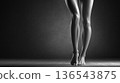 Woman's legs crossed standing silhouette monochrome photo 136543875