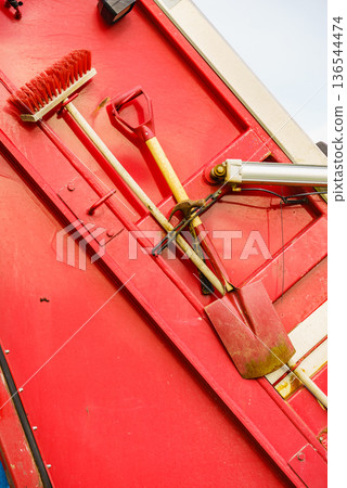 Garbage truck with broom and shovel. 136544474