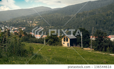 Modern Wooden House in Mountain Valley Landscape Modern Wooden House in Mountain Valley Landscape 136544618