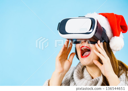 Girl watching 3d film tour in virtual reality glasses. 136544651