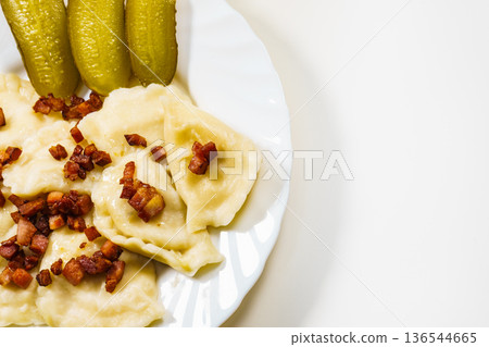 Dumplings with meat bacon scratchings. 136544665
