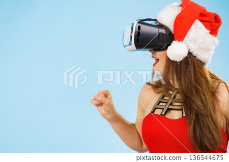 Girl watching 3d film tour in virtual reality glasses. Girl watching 3d film tour in virtual reality glasses. 136544675