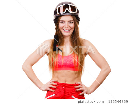 Female skier with arms on hips. Female skier with arms on hips. 136544869