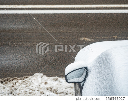 Close up of snow covered car side mirror in winter Close up of snow covered car side mirror in winter 136545027