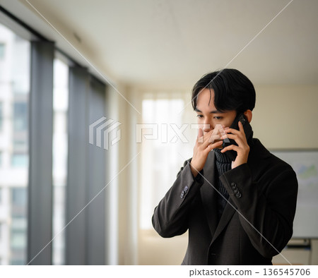 A man calling on a smartphone A man calling on a smartphone 136545706