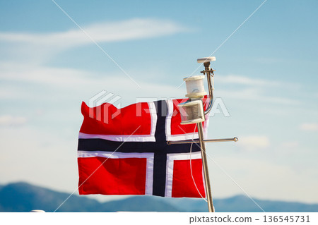 Norwegian flag on yacht mast Norwegian flag on yacht mast 136545731
