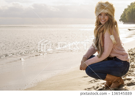 Fashionable woman on beach 136545889