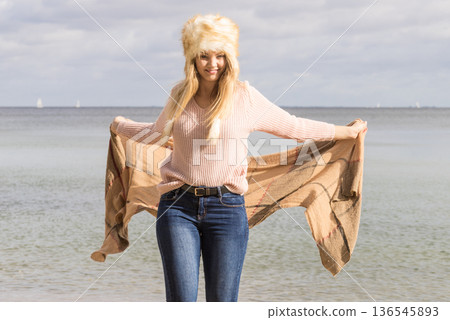 Fashionable woman on beach 136545893