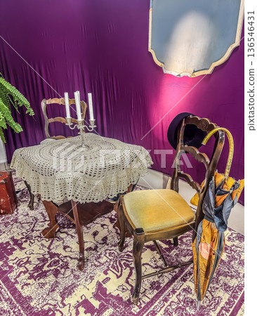 An eclectic and theatrical still life. This vintage-inspired room features antique furniture, a candelabra, and unique props creating a mysterious mood. High quality photo An eclectic and theatrical still life. This vintage-inspired room features antique furniture, a candelabra, and unique props creating a mysterious mood. High quality photo 136546431