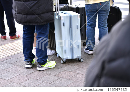 Yokohama cityscape in Japan. Inbound tourism continues... In front of Sakuragicho Station. Foreign tourists crossing the crosswalk... suitcases... Yokohama cityscape in Japan. Inbound tourism continues... In front of Sakuragicho Station. Foreign tourists crossing the crosswalk... suitcases... 136547585