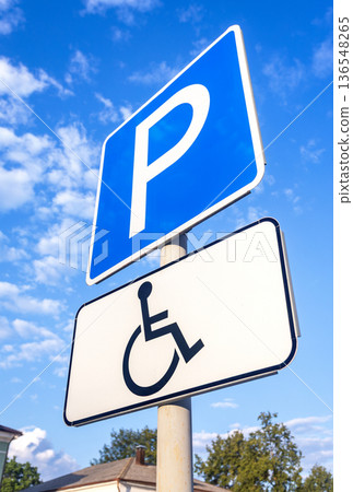 Road sign Parking place for the disabled against the blue sky 136548265