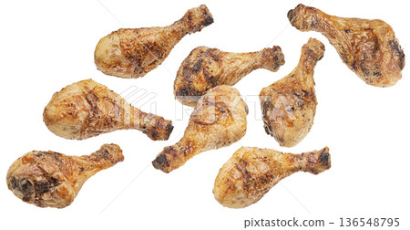 Falling grilled chicken legs, roasted drumsticks isolated on white background, full depth of field Falling grilled chicken legs, roasted drumsticks isolated on white background, full depth of field 136548795