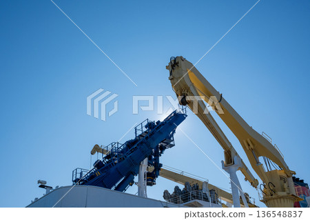 Crane on board and clear blue sky 136548837