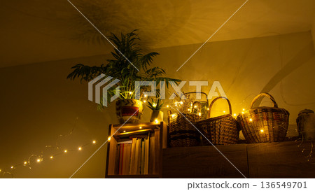 Warm glow from garlands and plants in the interior of the room Warm glow from garlands and plants in the interior of the room 136549701