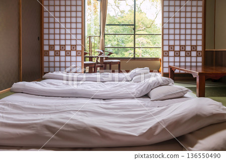 Japanese tatami floor beds and chairs in ryokan balcony, Yanagawa 136550490