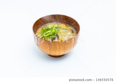 Stock photo of eggplant and green onion miso soup, a traditional Japanese soup with a white background Stock photo of eggplant and green onion miso soup, a traditional Japanese soup with a white background 136550578