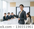 A Japanese woman in a business suit talking with a serious expression in an office conference room. Work, career, consultation 136551961