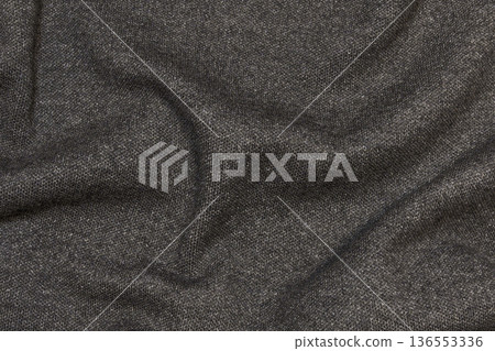 Draped black cotton fabric wrinkles Draped black cotton fabric wrinkles 136553336