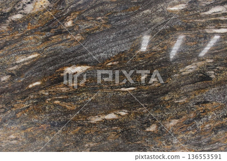 Cosmic Black granite marble with contrasting horizontal white and cream veins, often used for exclusive countertops and flooring. Cosmic Black granite marble with contrasting horizontal white and cream veins, often used for exclusive countertops and flooring. 136553591