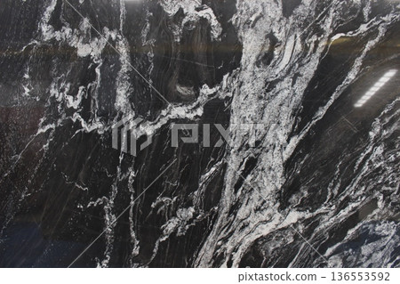 Copacabana marble from Brazil featuring contrasting black and white patterns resembling water flow or natural abstract paintings. Copacabana marble from Brazil featuring contrasting black and white patterns resembling water flow or natural abstract paintings. 136553592