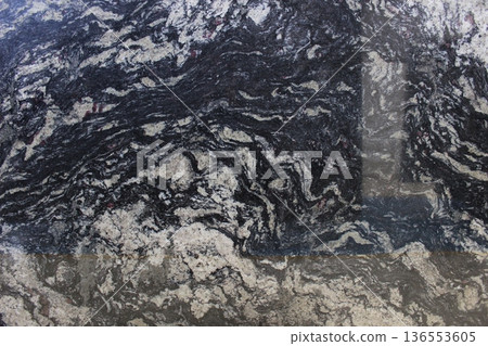 Black and grey marble texture with interlocking dynamic veins, natural stone material for artistic countertops and flooring surfaces. Black and grey marble texture with interlocking dynamic veins, natural stone material for artistic countertops and flooring surfaces. 136553605
