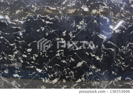 Cosmic Black granite texture with deep black base and small white spots and veins, elegant natural stone from Brazil for modern space. Cosmic Black granite texture with deep black base and small white spots and veins, elegant natural stone from Brazil for modern space. 136553606