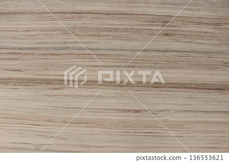 Detail of beige Serpeggiante wooden marble texture featuring dense and consistent natural line patterns. Detail of beige Serpeggiante wooden marble texture featuring dense and consistent natural line patterns. 136553621