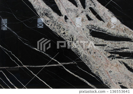 Black Horse or Copacabana marble with dramatic wide white vein patterns and coarse crystal texture. Black Horse or Copacabana marble with dramatic wide white vein patterns and coarse crystal texture. 136553641