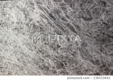 Texture of Grey William marble in grey color with dense and complex criss-cross vein patterns creating a dynamic visual look. Texture of Grey William marble in grey color with dense and complex criss-cross vein patterns creating a dynamic visual look. 136553642