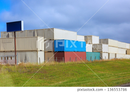 Containers stacked in shipping yard during day shipping cargo containers top down Containers stacked in shipping yard during day shipping cargo containers top down 136553786