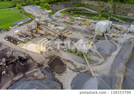 Construction site in quarry with large machinery piles of materials observed 136553799
