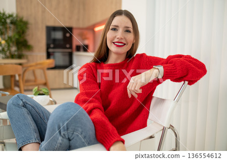 Pretty young caucasian woman in red looking confident and resolute 136554612