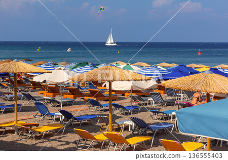 Colorful Beach Umbrellas and Sunbeds in Rhodes, Greece 136555403